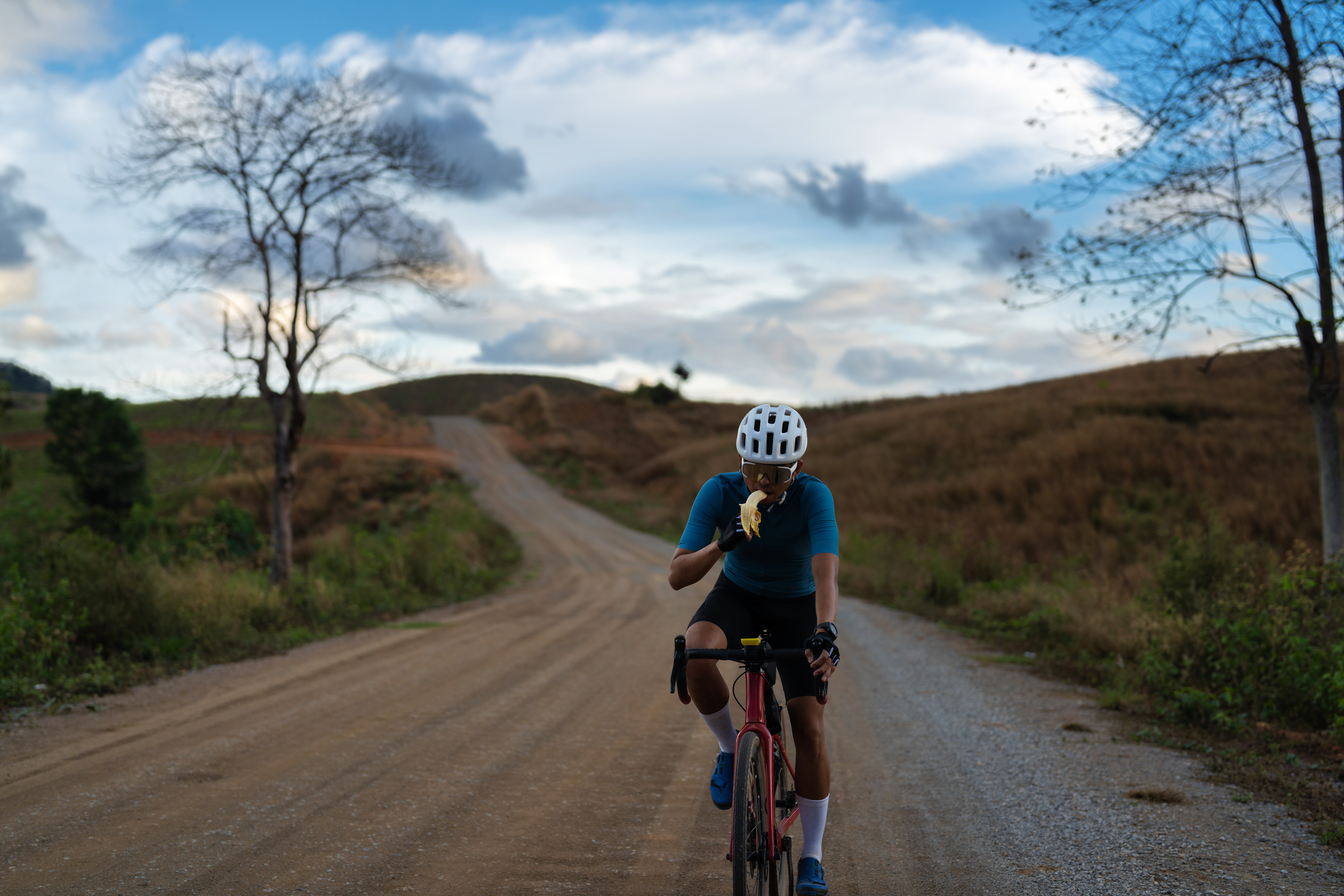 cyclist eating banana 